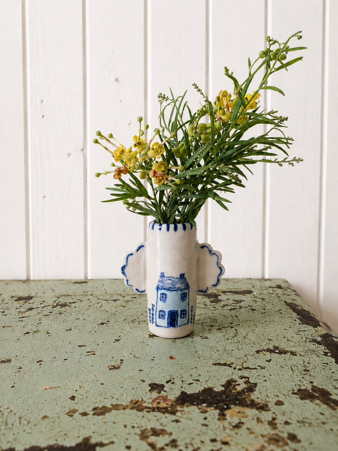 Winged bud vase